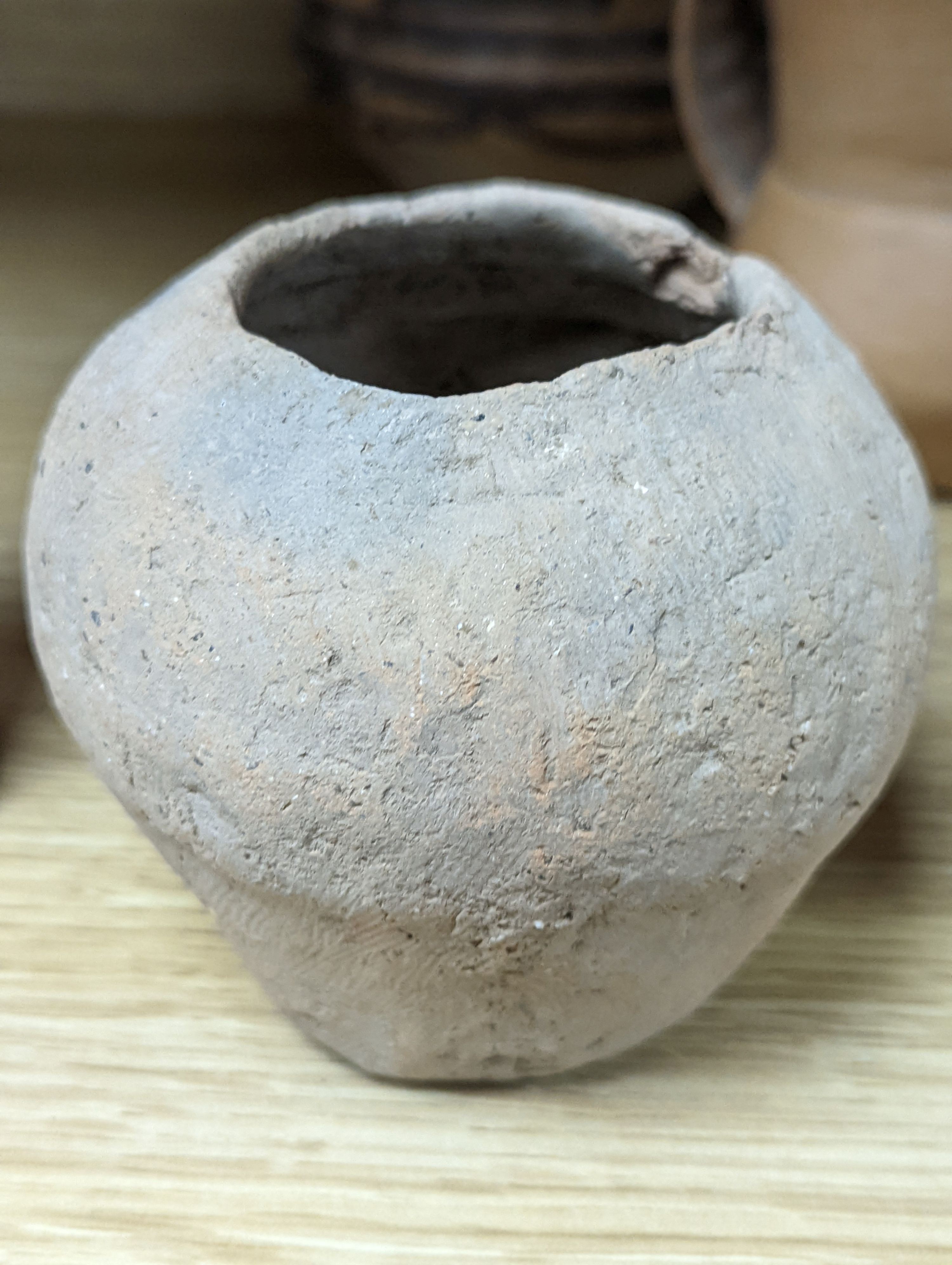 Four Chinese Neolithic pottery vessels, 11cm